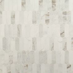 a white marble wall with hexagonal tiles