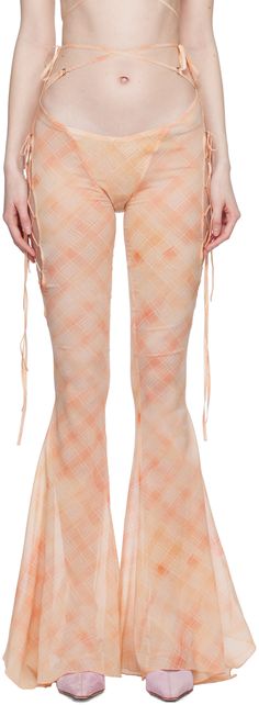 Semi-sheer stretch silk chiffon trousers. Check pattern printed throughout. · Low-rise · Wraparound self-tie straps at waistband · Flared cuffs · Cutout with lace-up detailing at outseams · Concealed zip closure at back Supplier color: Peach bleach Chiffon Trousers, Peach Pants, Graphic Fashion, Sugar Thrillz, Floral Prints Pattern, On The Red Carpet, Check Pattern, Silk Chiffon