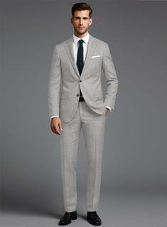 Build your elegant custom wardrobe with our Stretch Light Gray Wool Suit. Crafted from a wool blend, the suit has a smooth finish and is versatile enough to provide you a modern look and confident demeanor, also an ideal pick for any important occasion.  
 
 Look Includes  Stretch Light Gray Wool Fabric  Two Button Jacket Style  Notch Lapel  Horn Royal Black Buttons  Single Vent  Three Cuff Buttons  Two Welted Back Pockets on Trousers   You can change the look during customization if required. Custom Fit Suit In Suiting Fabric, Wool Suit And Tie Accessories For Business Casual, Timeless Tailored Suits For Office Wear, Slim Fit Suit With Pressed Crease For Business Casual, Slim Fit Suits With Pressed Crease For Business Casual, Sleek Notch Lapel Suit For Office, Sleek Notch Lapel Suits For Office Wear, Tailored Timeless Suits, Suits With Welt Pockets In Suiting Fabric