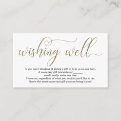 a business card with the words wishing well written in gold foil on white marble background