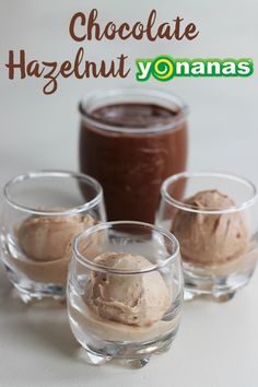 three glasses filled with chocolate hazelnut yogurt on top of a white table