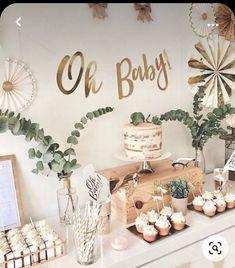 a dessert table with cupcakes and cakes on it