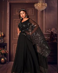 Trendy indowestern  crop top lehanga set.  This unique dress comes with attached style drape in metallic and satin material.  Fabric: Georgette and imported satin Color : black  Size :40 Pre-draped Saree With Dupatta For Navratri Party, Glamorous Georgette Dresses For Diwali, Semi-stitched Party Sets For Diwali, Party Pre-draped Saree With Mirror Work In Art Silk, Evening Georgette Gown For Diwali, Party Floor-length Art Silk Pre-draped Saree, Elegant Pre-draped Saree For Party Season, Diwali Evening Georgette Gown, Festive Pre-draped Saree For Party Season