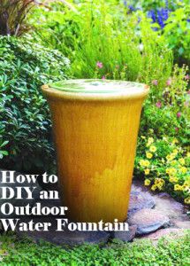 an outdoor water fountain surrounded by plants and flowers with the title how to diy an outdoor water fountain