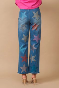 Experience the perfect blend of style and comfort with Blue B's Star Rhinestone Embellishment Straight Leg Jeans. Crafted with a unique blend of 70% cotton, 28% poly, and 2% span, these jeans offer a contemporary fit for everyday wear. Featuring a casual aesthetic adorned with star rhinestone embellishments, these jeans are sure to make a statement. Enjoy the quality and innovative designs that we are renowned for. Wear your personality, reflect your inner beauty, and be confident with every ste Fun Jeans, Ocean Hues, Rhinestone Jeans, Taylor Swift Tour Outfits, Hi Fashion, Simple Top, Rhinestone Embellishments, Embellished Jeans, Star Spangled