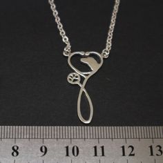 Introducing our creative design of necklace for Vet Doctor. We have a dog head crafted into the stethoscope. You can absolutely ask us to make for Cat, Horse, Cow, Lamb and so on (Any animal that fit). Base Material: 925 Sterling Silver Size: 13mm(W) X 30mm(H) (Approximately) Chain Length: 16'' - 24'' Inches (Selectable) Metal Stamped: 925 Handling Time: 7 - 14 working days Thickness: 1.5mm / 0.059 Inch You'll receive Order Shipped Email from us when your item is completed and shipped. SPECIAL A Vet Doctor, Vet Tech Appreciation, Stethoscope Necklaces, Animal Doctor, Gifts For Veterinarians, Wolf Jewelry, Vet Tech, Moon Jewelry, Metal Stamping