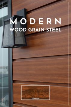 the modern wood grain steel exterior wall light is mounted on a wooden paneled building