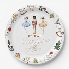 a personalized plate with nutcrackers and christmas decorations on the front, in gold lettering