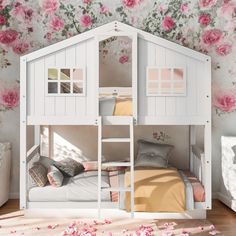 a white bunk bed with pink flowers on the wall