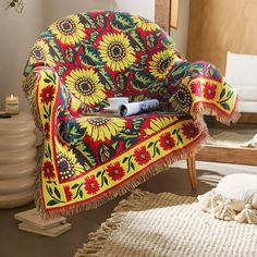 a chair with a colorful blanket on top of it