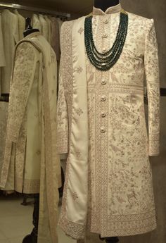 Make a grand statement on your special day with a luxurious Sherwani crafted from premium fabrics (like silk, brocade, or georgette) for ultimate comfort and sophistication. Our collection boasts a variety of designs to suit every taste: Classic elegance: Opt for a timeless Sherwani with intricate embroidery on the collar or cuffs. Modern flair: Go for a Sherwani with a unique neckline or a trendy color palette. Regal opulence: Choose a Sherwani with rich embellishments like zardozi work for a t Luxury Designer Silk Sherwani, Luxury Designer Embellished Sherwani, Trendy Color Palette, Mens Wedding Suits, Zardozi Work, Silk Brocade, Wedding Suits Men, Intricate Embroidery, Churidar