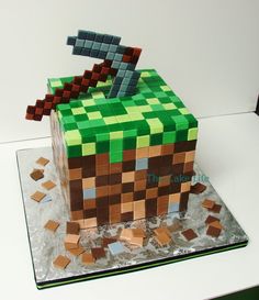 a cake made to look like an apple with blocks on it and the letter e