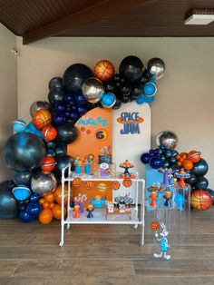 a basketball themed birthday party with balloons and decorations