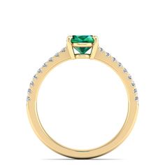 This exquisite ring features a stunning oval emerald stone surrounded by sparkling diamonds, creating a timeless and elegant piece of jewelry. The emerald's rich green color is beautifully complemented by the brilliance of the diamonds, making it a perfect choice for special occasions or as a luxurious everyday accessory. Metal: 14K Gold Setting Type: Prong Rhodium Finish: Yes, on White Gold Gemstone Details: Gemstone: Emerald Shape: Oval Average Dimensions: 8.00 x 6.00 MM Quantity: 01 Average C Oval Emerald Rings With Pave Setting, Oval Emerald Ring With Pave Setting For Anniversary, Oval Emerald Ring With Pave Setting, Emerald And Diamond Ring, Dance Jewelry, Rich Green, Birthstone Gifts, Ring Pendant Necklace, Emerald Stone