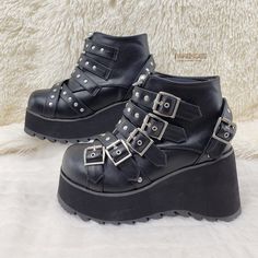 3 1/2" (89mm) Wedge Platform Ankle Bootie Multiple Studded Buckle Straps & Front Zip Closure w/ Skull Head Sizes 6-11 ***PLEASE NOTE *** Due to High Volume Sales Pleaser/ Demonia has stopped all Direct Shipping Orders may take up to 6 weeks to arrive as we have to order them in to ship to you Shop Our collection of Demonia In House for FAST Shipping!! These ship direct from Pleaser and size availability does varyRefund will be issued if your size or color is not availablecontact us with any ques Goth Shoes, Goth Scene, Skull Head, Goth Punk, Platform Ankle Boots, Black Platform, Shipping Orders, Ankle Bootie, Black Matte