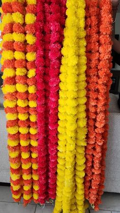 colorful garlands hanging on the side of a building