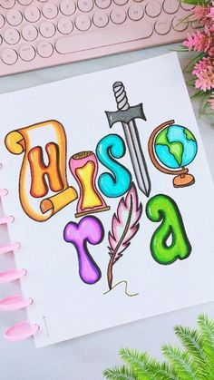 a notebook with the word miss written in colorful letters and a pen next to it