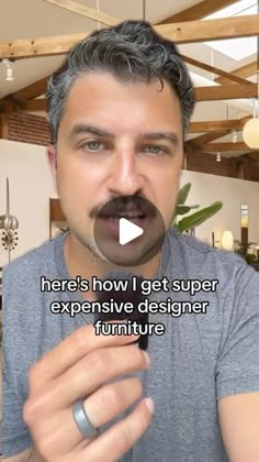 a man with a fake moustache on his face is making a funny face