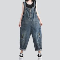 Revamp your style this summer with our vintage-inspired whiskered women's denim jumpsuit from the 2023 Spring-Summer Collection. With a baggy fit. bold suspenders closure. and distressed detailing. this jumpsuit will make you stand out from the crowd.Why They're Your Next Summer Staple Vintage-Inspired Design: A perfect combination of vintage charm and contemporary style. this jumpsuit will make you look effortlessly stylish. Whiskered Detailing: Subtle whiskered detailing on the front and back Trendy Dark Wash Distressed Denim Jumpsuit, Trendy Distressed Dark Wash Denim Jumpsuit, Casual Summer Denim Jumpsuit With Suspenders, Trendy Summer Denim Jumpsuit With Suspenders, Trendy Distressed Denim Blue Overalls, Summer Medium Wash Denim Jumpsuit With Suspenders, Trendy Ripped Dark Wash Overalls, Denim Jumpsuits And Rompers With Suspenders For Summer, Distressed Denim Overalls And Rompers