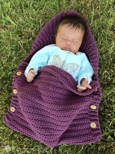 a baby sleeping in a purple crochet blanket on the grass with text overlay that reads, sleep sack crochet pattern free pattern