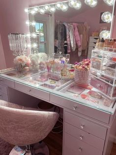 the vanity is full of beauty products and makeup accessories, as well as its lighted mirror