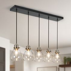 Incorporate modern sense into your living space with this uniquely Matte Black and Electroplated Copper with Cup Glass Modern/Contemporary Clear Glass Bell Mini Pendant Light by Uofin Lighting, safely rated for dry locations. The clear bell glass shade of this mini glass pendant lights for foyer helps illuminate your house at maximum range with a soft warm lighting effect day and night. The overall design of this black liner chandelier makes this gold kitchen pendant lighting a perfect combination of beauty and utility, easily adapting to various home decor. Whether modern, industrial, contemporary, or transitional, these stylish chandeliers for kitchen will always add a chic charm to any interior decoration with its solid and high-end outline. If your dining room, kitchen, bedroom, corrid Liner Chandelier, Gold Kitchen Pendant Lights, Lighting Fixtures Kitchen Island, Island Light Fixtures, Kitchen Island Light, Kitchen Chandelier, Kitchen Island Chandelier, Kitchen Pendant, Linear Pendant Light