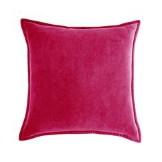 a purple pillow on a white wall