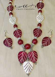 "Experience the timeless elegance of our \"Chic Red & White Beaded Handmade Necklace and Earrings Set.\" This exquisite jewelry ensemble beautifully blends the classic charm of red and white, featuring a stunning necklace and coordinating earrings that radiate sophistication and style. Necklace Details: Step into a world of refined beauty with this handcrafted necklace, meticulously designed to capture the allure of red and white. Each bead is carefully selected, creating an enchanting pattern that catches the eye.  Earrings Details: The matching beaded earrings mirror the necklace's captivating design, adding a touch of elegance to your ensemble. Suspended from hypoallergenic ear wires, these earrings sway delicately, reflecting light with every movement.  Craftsmanship: Our skilled artis Jewelry Sets Handmade, Long Pearl Earrings, Necklace And Earrings Set, Handcrafted Necklace, Stunning Necklace, Ethnic Jewelry, Necklace And Earrings, Style Necklace, Handmade Necklace