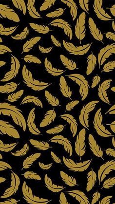 a black and gold background with lots of feathers