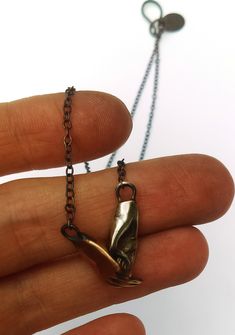 This bronze and silver holding hands necklace has been my best seller this year. It is a great talisman for connection. To me it represents unity, diversity and inclusion. The hands are fused together but are still able to wiggle which is wonderful for giving the piece movement. Each hand is each 3/8" long and the chain can be ordered 16" or 18". Claw Jewelry, Diversity And Inclusion, Hand Necklace, Hand Jewelry, Necklace Handmade, Best Seller, Handmade Necklaces, Holding Hands, Arrow Necklace