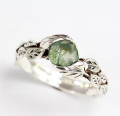 Exclusive to Benati! Natural and floral, beautiful leaves are holding this fine natural moss agate gemstone. Please note each stone has it's own character - as they are natural, no two stones are alike.  They are unique - just like you! This is a very special ring :) Leaves ring hand crafted to perfection in sterling silver or 14k gold, with some oxidized areas to show the leaves even nicer! Top quality natural round moss agate of approx. 0.80 carats. This ring has lovely natural motifs of leave Non Traditional Silver Engagement Rings, Miss Agate Engagement Ring Silver, Nature-inspired Emerald Ring, Nature-inspired Wedding Rings With Natural Stones, Moss Agate Ring Silver, Silver Moss Agate Ring, Moss Agate Engagement Ring Silver, Forest Rings, Moss Agate Wedding Ring