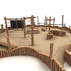 an outdoor play area made out of wood sticks and sand with a playground in the background