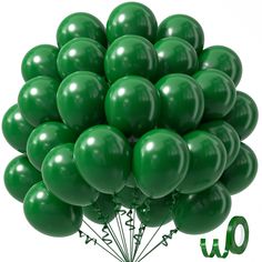 a bunch of green balloons sitting on top of each other