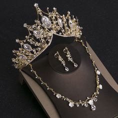 a tiara and earrings are on display