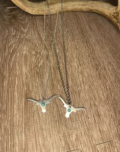 Longhorn necklace with small turquoise bead. With stainless steel or silver plated chain. 18inch long chain. Longhorn Necklace, Charm Necklaces, Long Chain, Turquoise Beads, Charm Necklace, Silver Plate, Silver Plated, Gadgets, Jewelry Necklaces