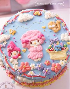 there is a cake decorated with hello kitty decorations