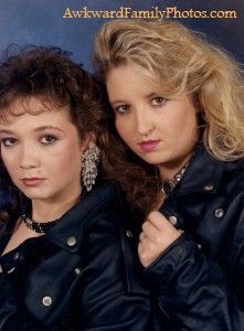 two women in leather jackets posing for the camera with their hands on their hipss