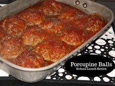 a pan filled with meatballs sitting on top of a table