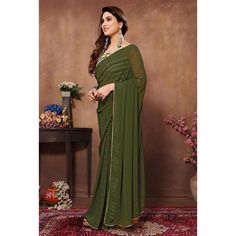 Green colored saree is made from georgette fabric which is highlighted with weaving checks & lace border work as shown with pleats are stitched and size adjusted belt. comes along with printed banglori silk blouse which you can customise as per your design/style. Occasion - You can wear this saree for parties, functions and events. Note:- the actual product may differ slightly in color and design from the one illustrated in the images when compared with computer or mobile screen. Measurements: S Festival Georgette Pre-draped Saree With Border, Fitted Georgette Traditional Wear With Printed Border, Designer Pre-draped Georgette Saree With Printed Border, Traditional Chiffon Saree With Printed Border, Designer Georgette Sets With Printed Border, Navratri Pre-draped Saree With Printed Border, Fitted Chiffon Saree For Navratri, Green Georgette Dupatta With Printed Border, Georgette Dupatta With Border