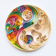 a paper plate with colorful swirls on it