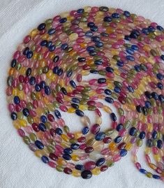 multicolored glass beads on white cloth