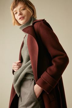 Material: 100% Wool Discover the perfect balance of fashion and warmth with our High-Necked Wool Sweater. This winter essential features a snug high neckline that adds a touch of elegance to your ensemble. Its classic design ensures versatility, allowing you to effortlessly pair it with various outfits. Stay chic and cozy throughout the season. Care: To maintain its plush texture and long-lasting durability, we recommend professional dry cleaning or hand washing in cold water with a mild cashmer Elegant Brown Winter Outerwear, Solid Funnel Neck Outerwear For Work, Fitted Solid Turtleneck Outerwear, Casual Fitted High Neck Outerwear, Chic Wool Outerwear For Layering, Classic Turtleneck Outerwear, Classic Solid Turtleneck Outerwear, Winter Outerwear For Layering, Fitted Brown Turtleneck Outerwear