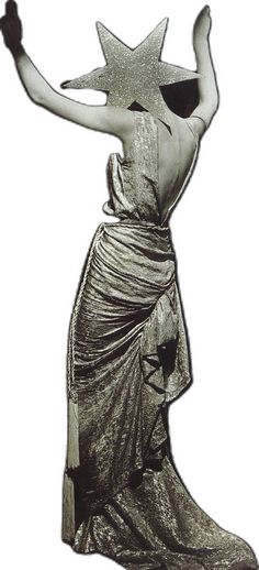 a woman in a long dress with a star on her head and arms outstretched to the side