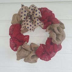 a burlap wreath with red, white and blue stars