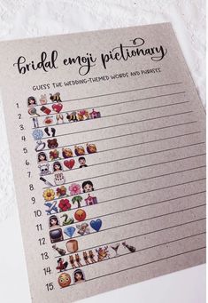 the bridal emojtionary is on top of a white lace tablecloth