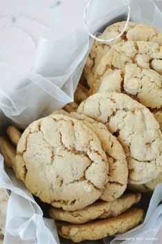 some cookies are in a white paper bag