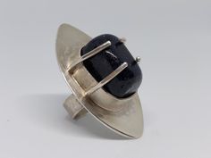 One-of-a-kind, handcrafted Sterling Silver ring with Blue Goldstone, Size 6 Modernist Oval Rings With Polished Finish, Modernist Round Cabochon Jewelry, Modern Cabochon Sapphire Ring For Gift, Modernist Formal Cabochon Rings, Modernist Oval Cabochon Rings, Modern Jewelry With Large Round Stone, Modernist Gemstone Jewelry For Gifts, Modern Round Jewelry With Large Stone, Modernist Oval Sterling Silver Ring