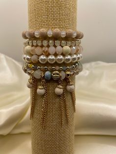 -Color: Gold Pearl Ivory -Comes in assorted beads  - 6 line stretch bracelet Cream Beaded Stretch Bracelet With Round Beads, Cream Stretch Bracelet With Round Beads, Adjustable Cream Beaded Bracelets For Party, Oct 1, Gold Pearl, Stone Bracelet, Stretch Bracelet, Stretch Bracelets, Charm Bracelet