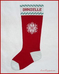 a red and white christmas sock with snowflakes on it