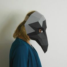 DIGITAL DOWNLOAD Whether you choose to represent the Jackdaw, Rook or the Raven, this handsomely ominous Mask will let another species know that you are a high-flying, high-concept-contemplating creature. Our Trophy Masks mostly encase one human head, leaving an open back for the brain to breathe and for pony tails, dreadlocks and mullets to swing free. Your Trophy Mask can also be custom-fitted with our new component-locked internal headband included in the template. Like all our designs these Mask Papercraft, Papercraft Mask, Low Poly Mask, Crow Mask, 3d Mask, Mask Collection, Surviving In The Wild, Pony Tails, Jackdaw